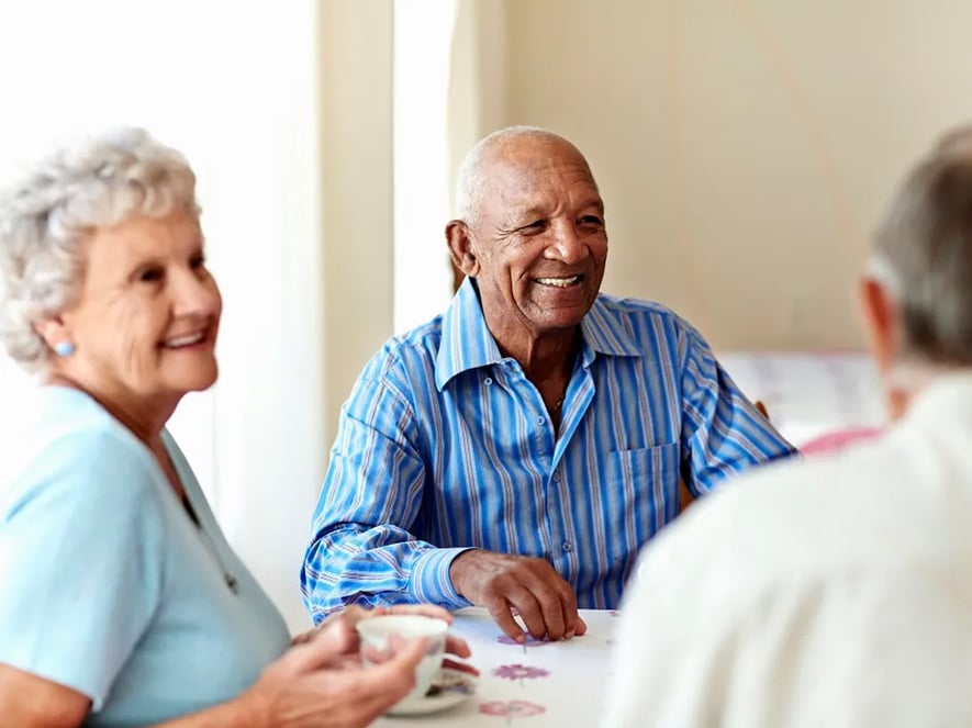A group of friends enjoying a cup of tea. 