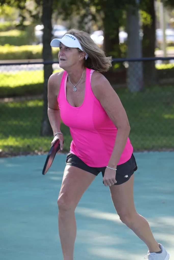 Cheryl Miller playing pickleball outdoors