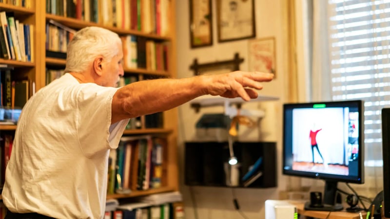 A man managing Parkinson's disease with exercise