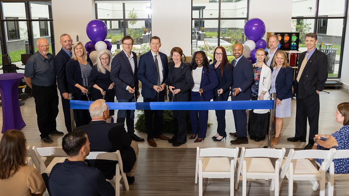 Group of community and healthcare leaders participate in a ribbon-cutting ceremony inside the new Encompass Health Rehabilitation Hospital of Lower Providence healthcare facility.