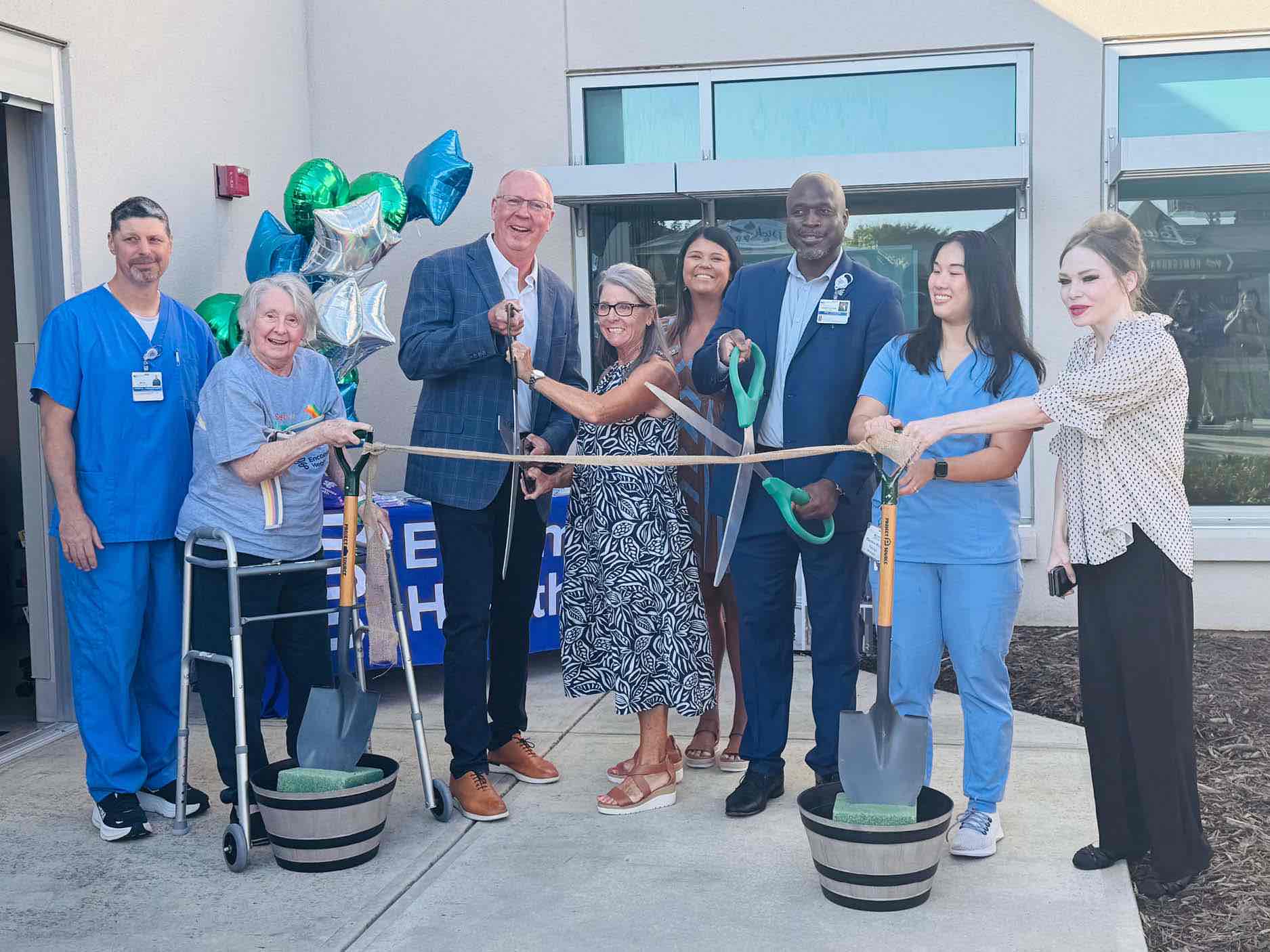 Rehabilitation hospital leaders, staff and former patients celebrate a grocery store simulator ribbon cutting, showcasing a hands on therapy space designed to support stroke recovery and independence.
