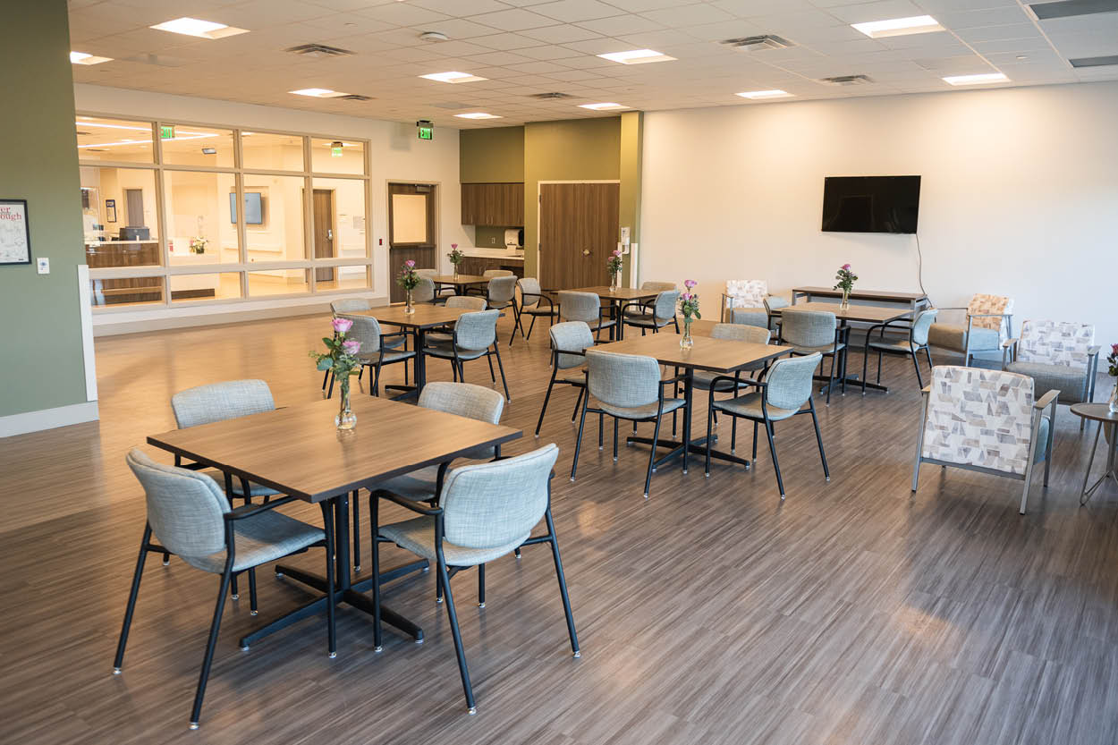 Encompass Health Rehabilitation Hospital of Bangor grand opening showcases a bright patient dining area with modern seating and decor.