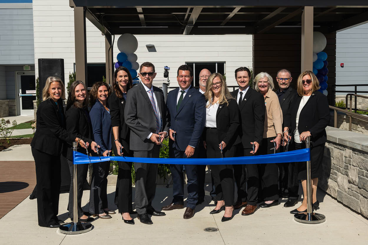 Community leaders and healthcare partners participate in a ribbon-cutting ceremony celebrating the Encompass Health Bangor grand opening.