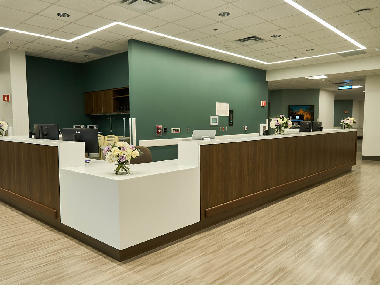 Reception area at Encompass Health Rehabilitation Hospital of Westover Hills highlighted during the grand opening, featuring a modern front desk.