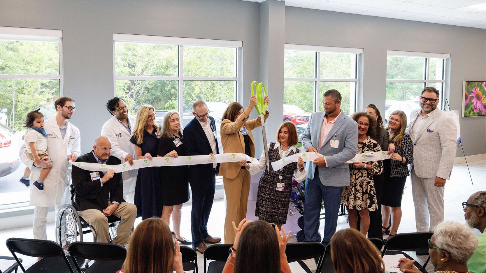 Community leaders and hospital representatives celebrate the Encompass Health Greenville bed expansion with a ribbon cutting.