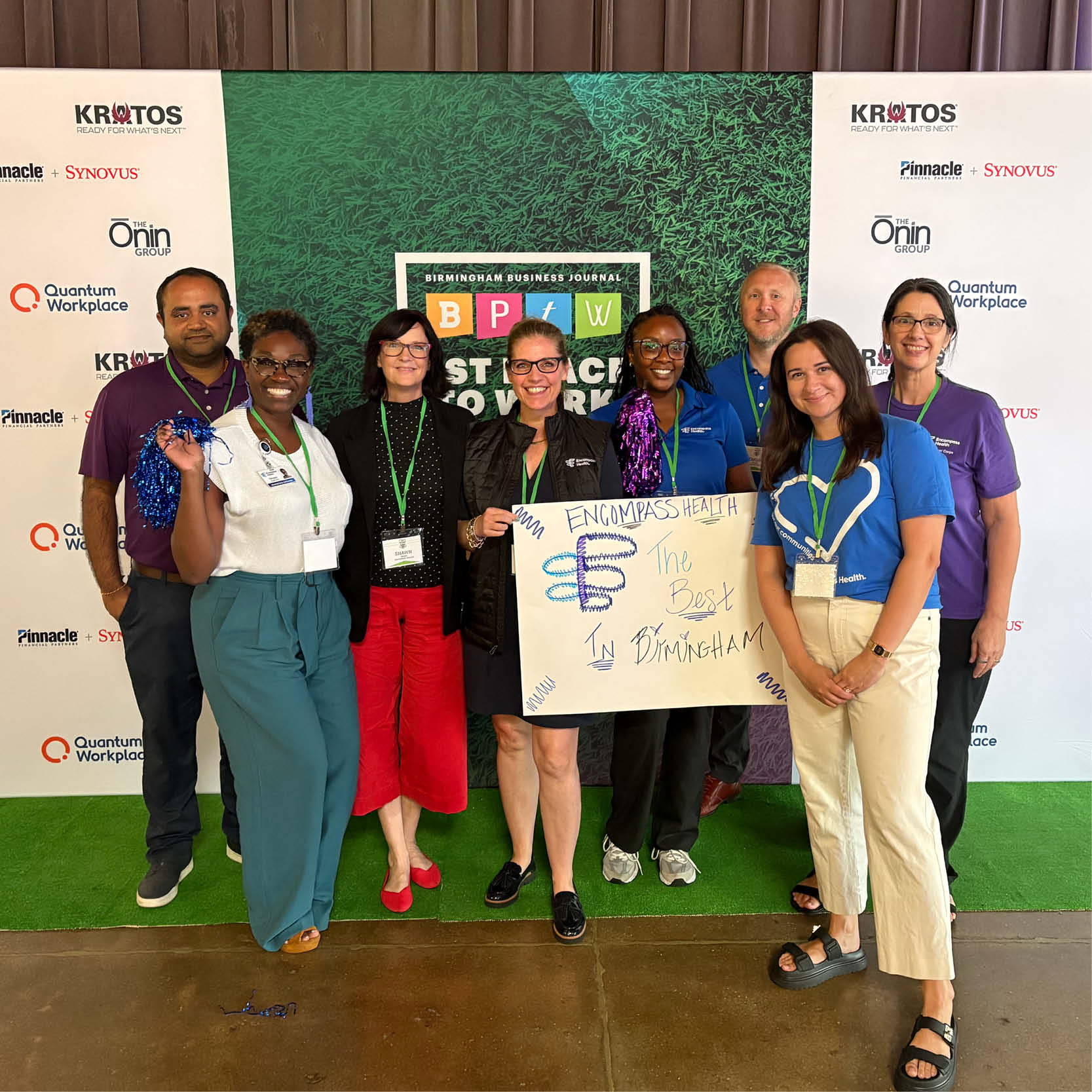 Encompass Health team members pose at the Birmingham Business Journal Best Places to Work event, celebrating workplace recognition with a group photo.