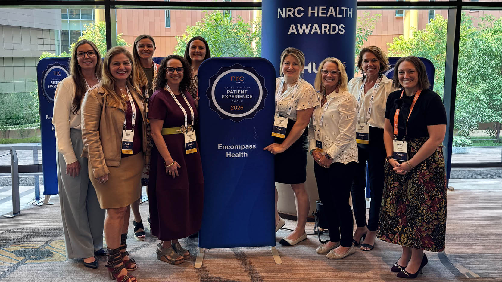 Encompass Health team members pose with the NRC Health 2026 Excellence in Patient Experience Award, celebrating recognition for exceptional rehabilitation care.
