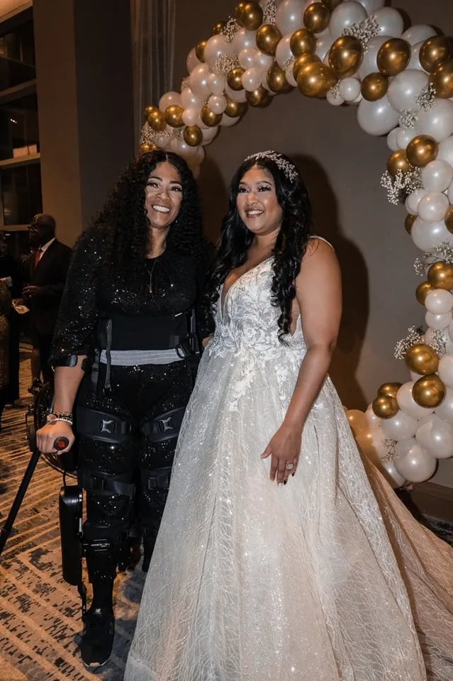 April Ballentine taking a photo with daughter.