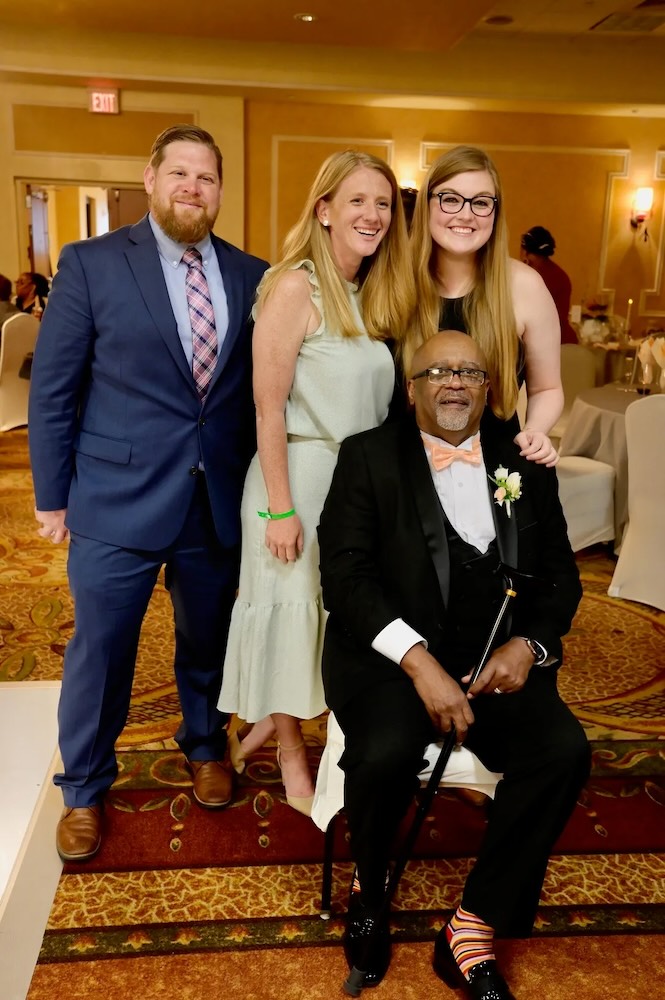 Jeff, an Encompass Health patient, poses with his therapists during his wedding wedding