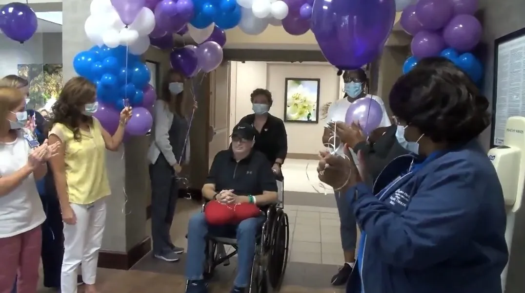 Tom Haney's care team celebrates his departure at Encompass Health Rehabilitation Hospital of Dothan.