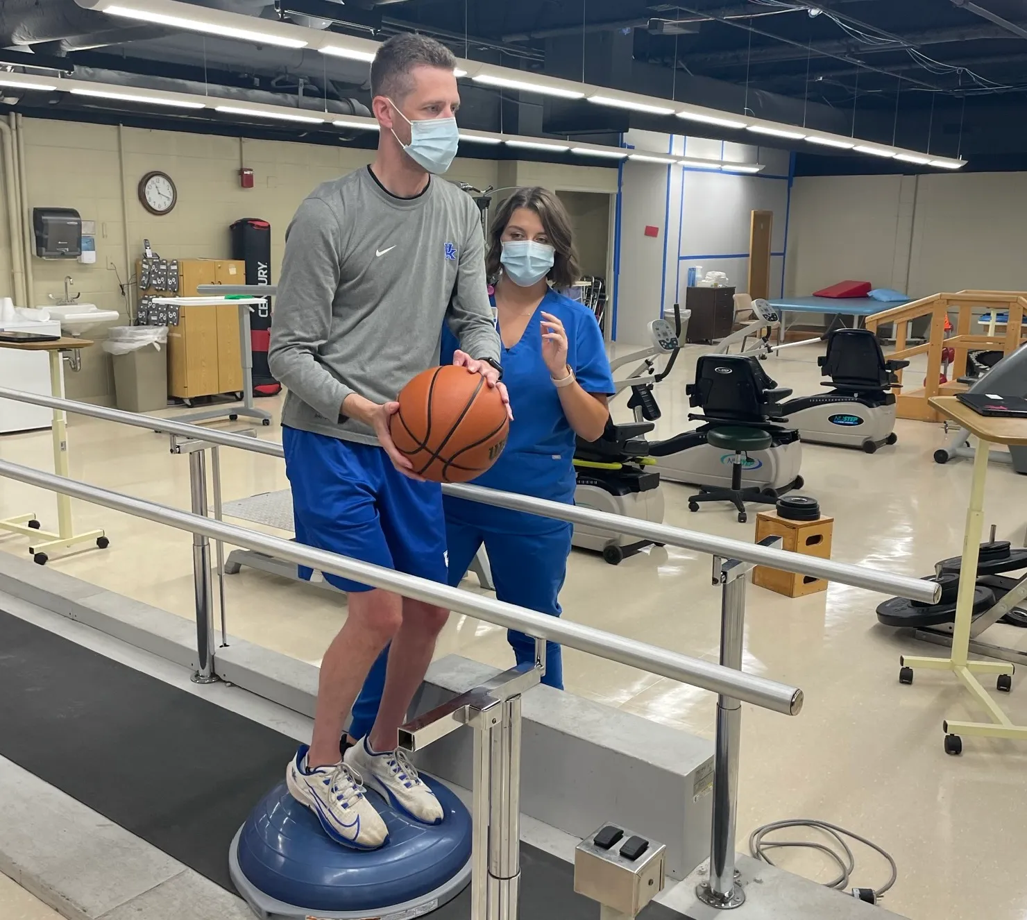 Matt working with therapist to regain his balance in therapy gym at Encompass Health