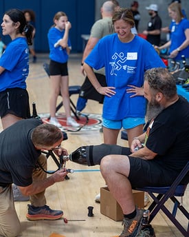 Amputee getting their prosthetic adjusted