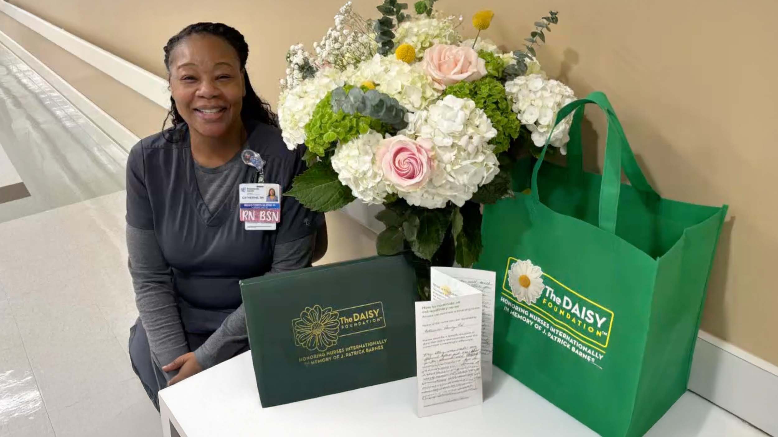 Our employee sitting with her Daisy award