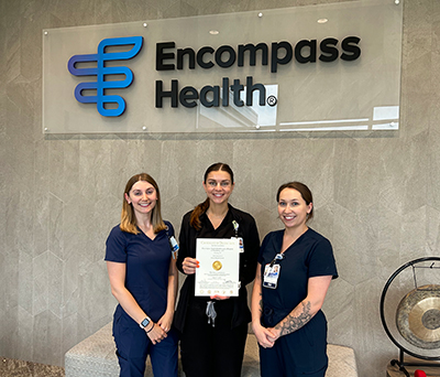 Encompass Health Fitchburg nurses holding a TJC Accreditation certificate