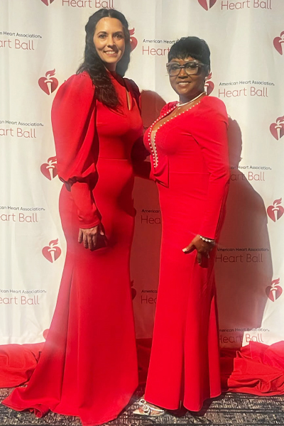 2025 AHA Heart Ball attendees posing in front of a backdrop