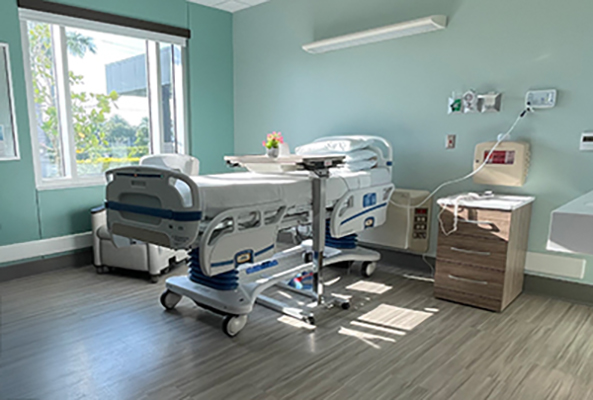 Encompass Health Naples patient bed in private room