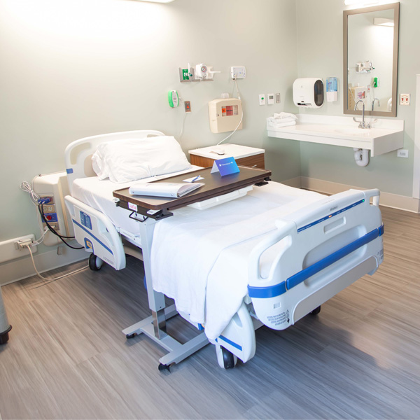 Patient bed in new private room at South Plains Rehabilitation Hospital