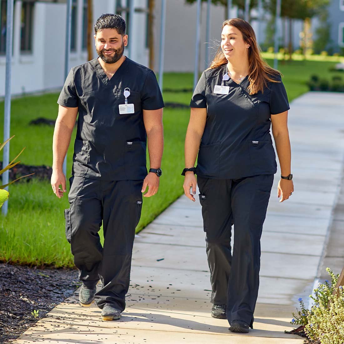 Nurses walking outside of a rehabilitation facility