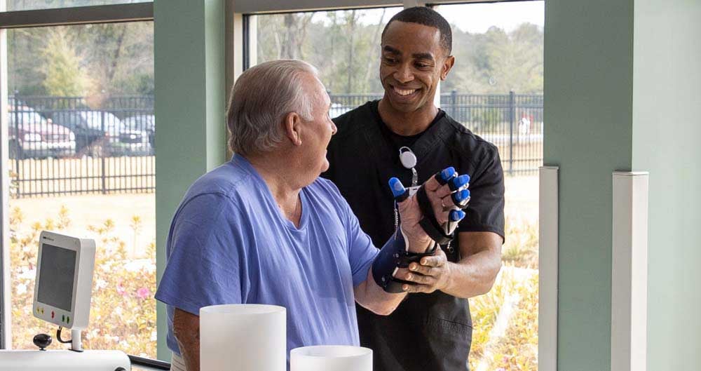 Patient being assisted by a physical therapist with our technology