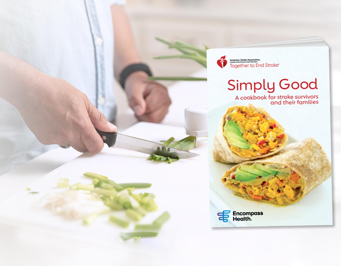 A cook slicing vegetables with a cookbook on the table