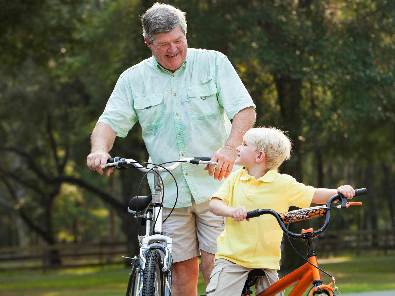 Grandfather and grandson biking