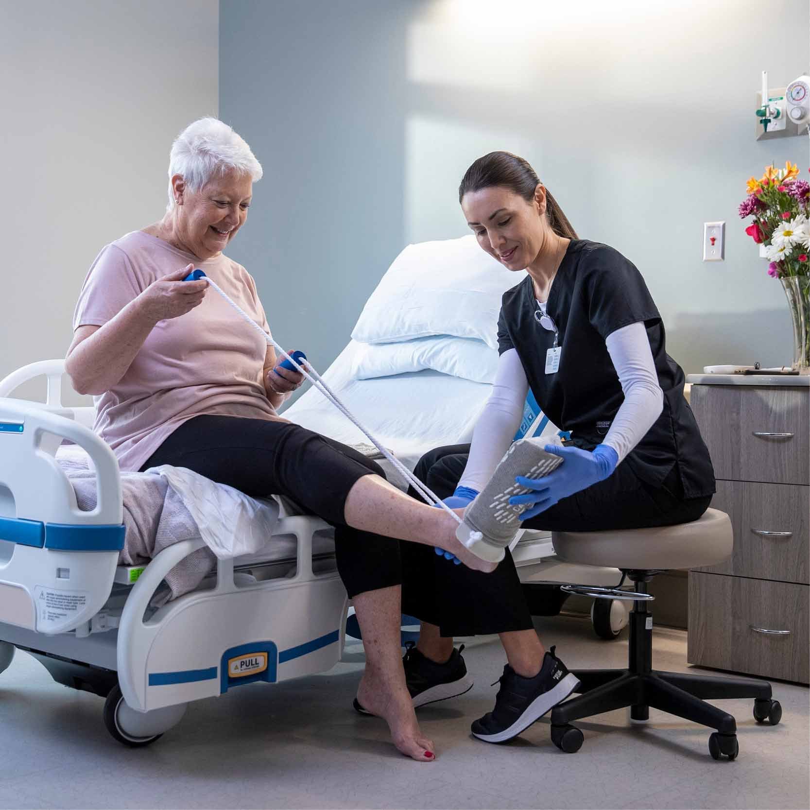 therapist and a nurse stretching