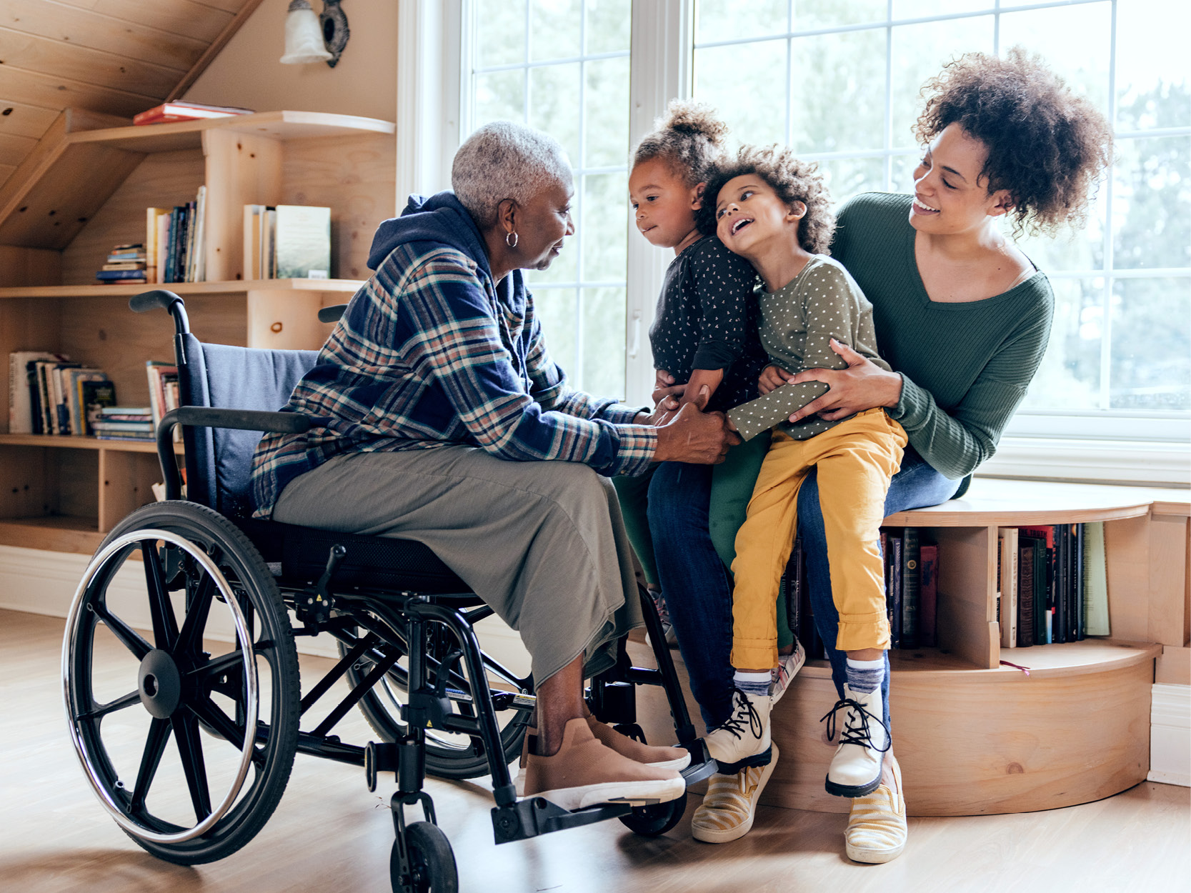 a person in a wheelchair playing with grandkids