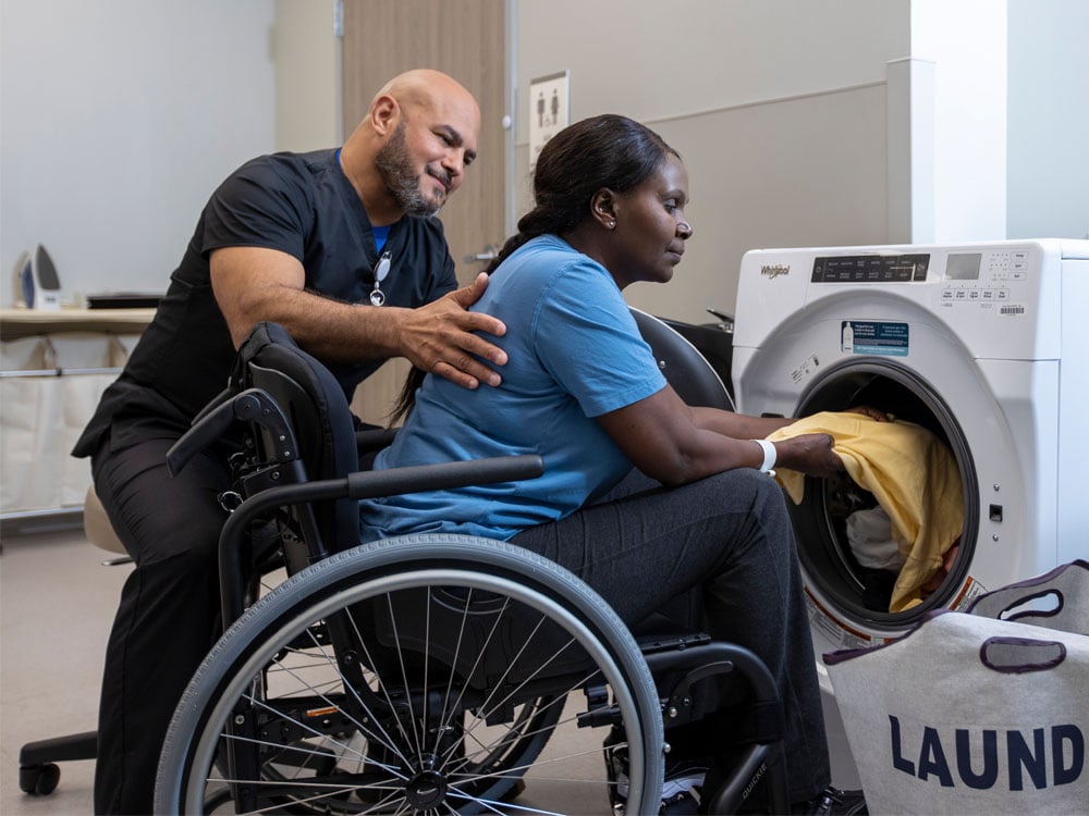 A patient doing laundry
