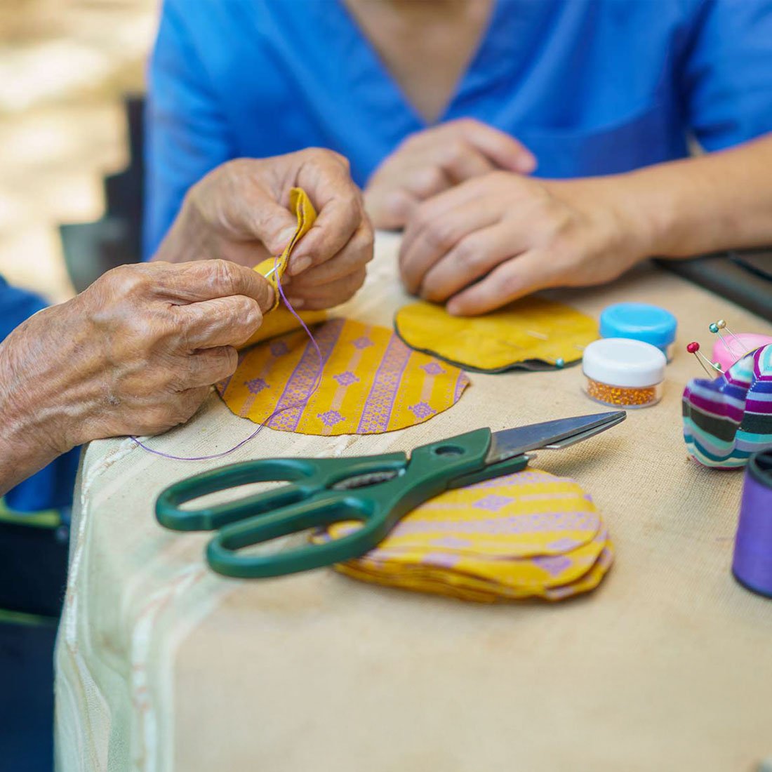 A patient creating art with a therapist