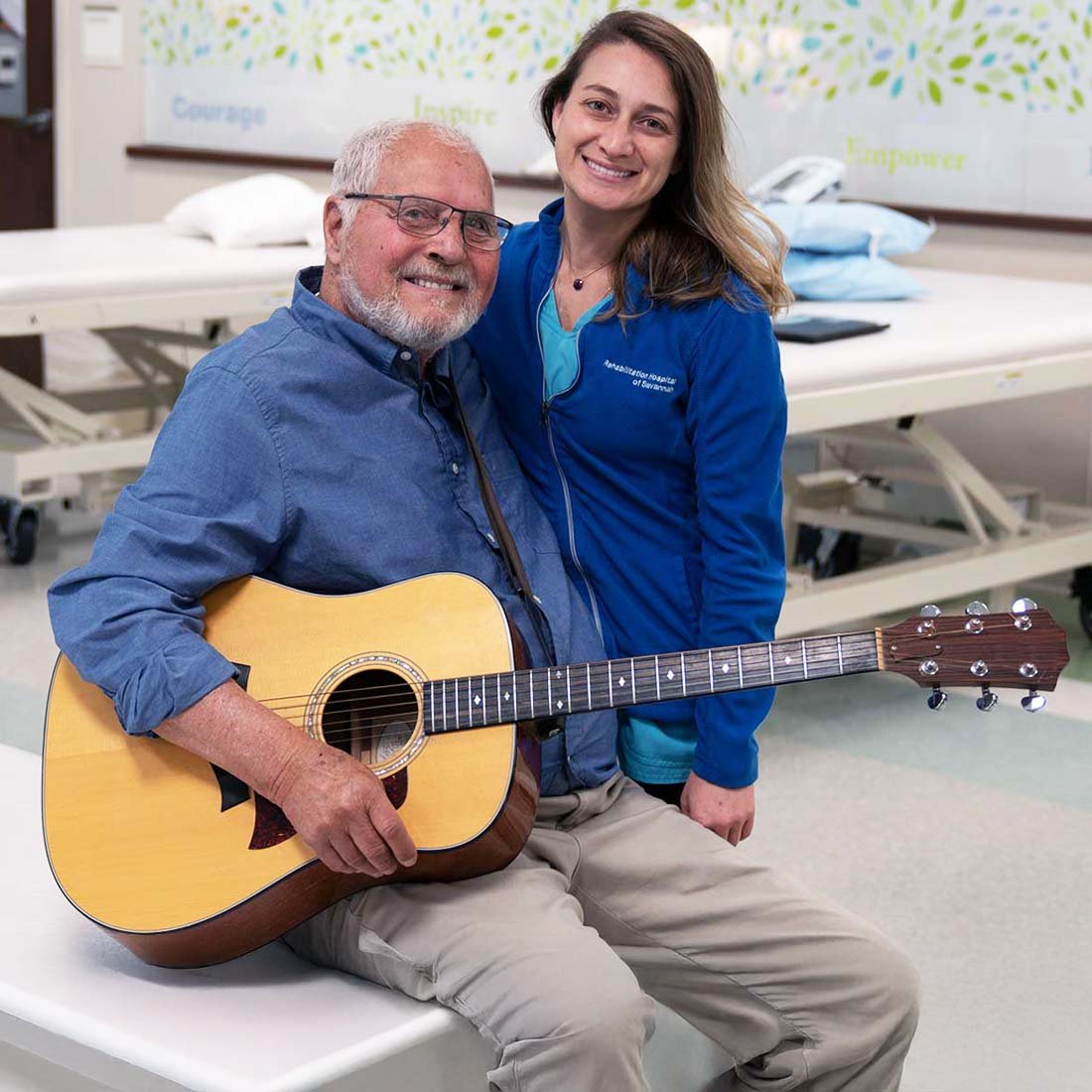 A patient holding a guitar