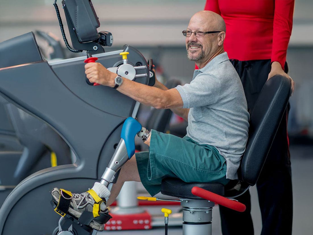 amputation patient using technology during rehabilitation