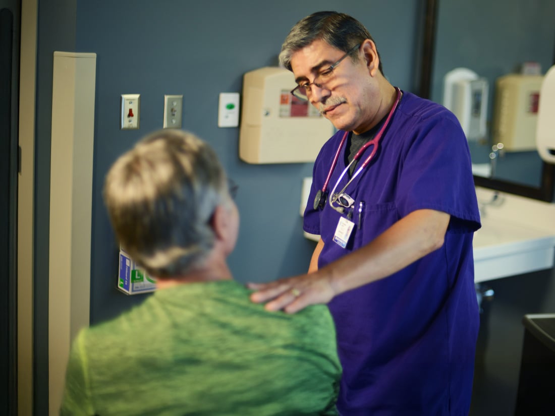 Nurse speaking with a patient