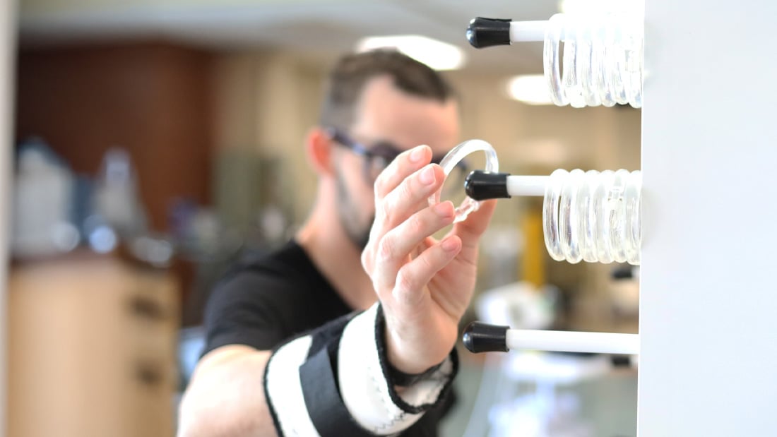 patient placing rings on a rack