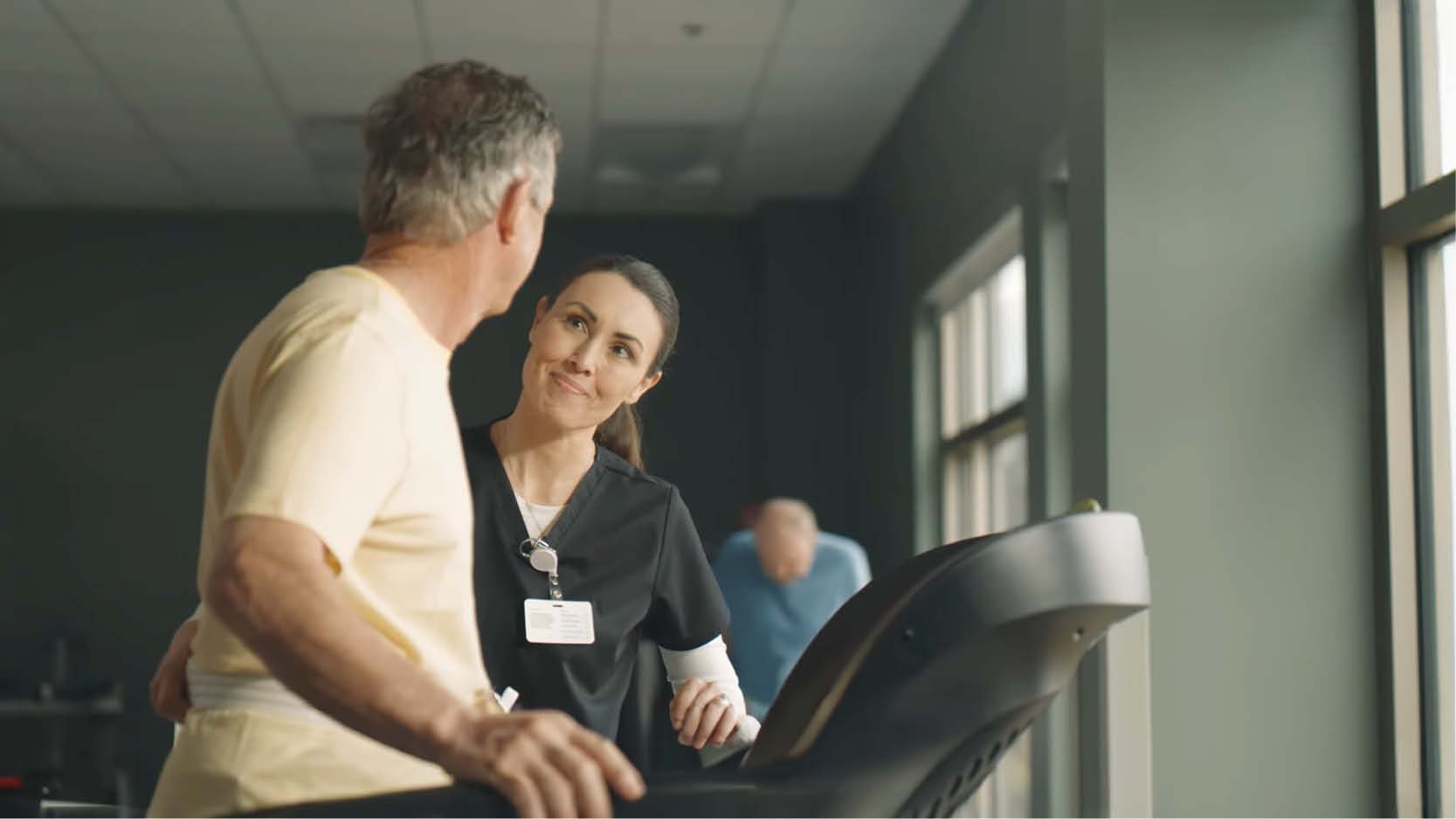 Patient participates in treadmill training with support from a rehabilitation therapist, highlighting inpatient rehabilitation, mobility recovery and personalized therapy goals.
