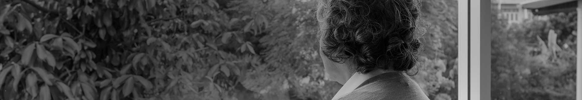 Woman looking out of window