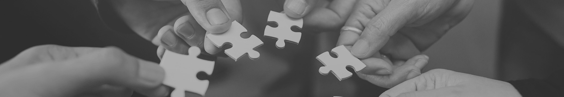 Hands and jigsaw puzzle pieces