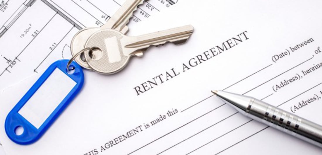 rental agreement with keys and pen