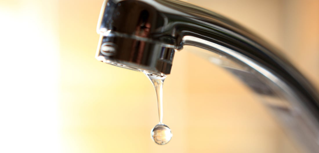 water dripping out of a faucet