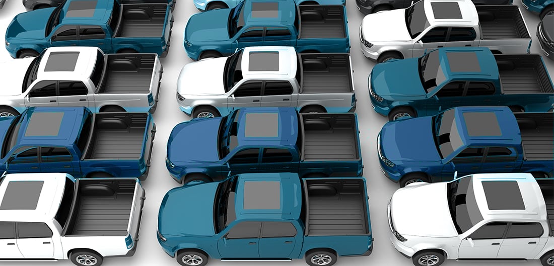 rows of parked pickup trucks