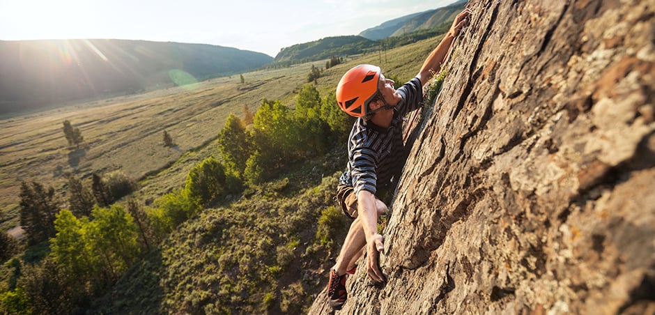 Person climbing a mountain