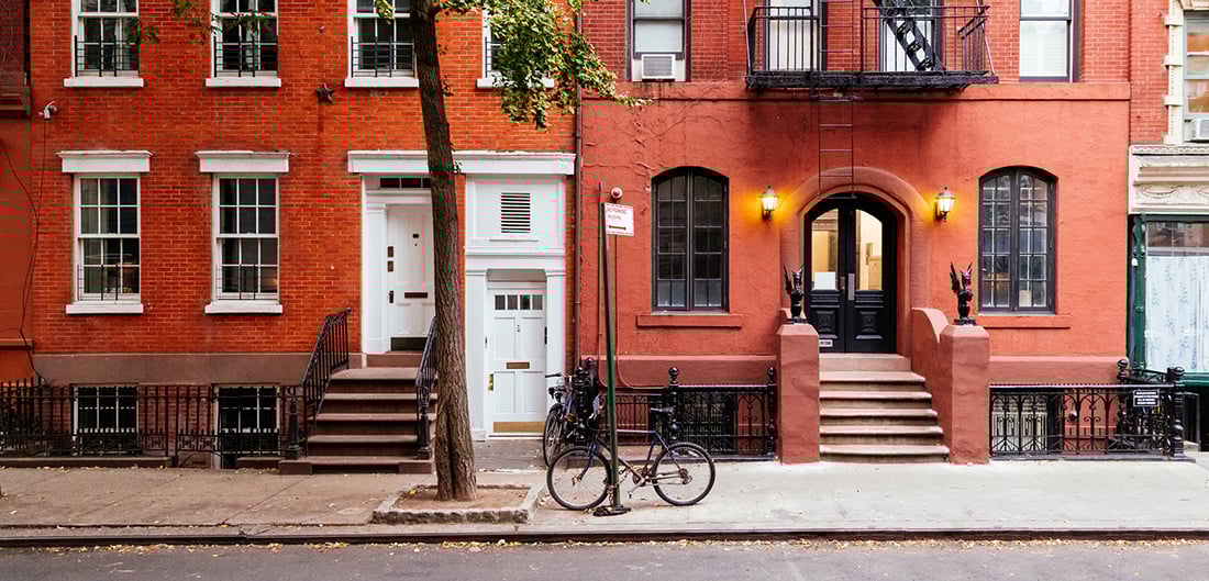 a bike parked outside a townhome