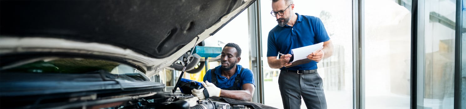 Two men working on a car