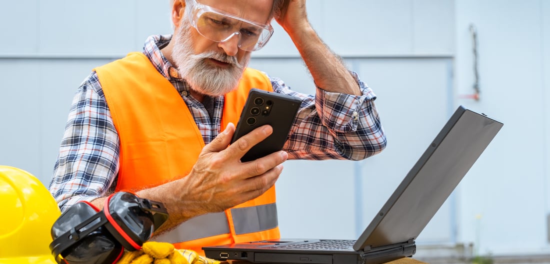 Construction worker using digital devices