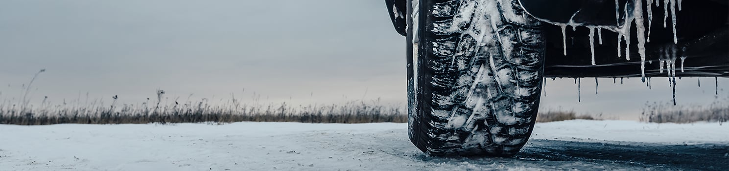 car tire on icy road