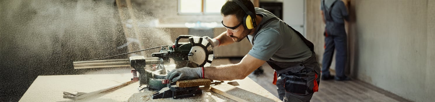 man using a table saw