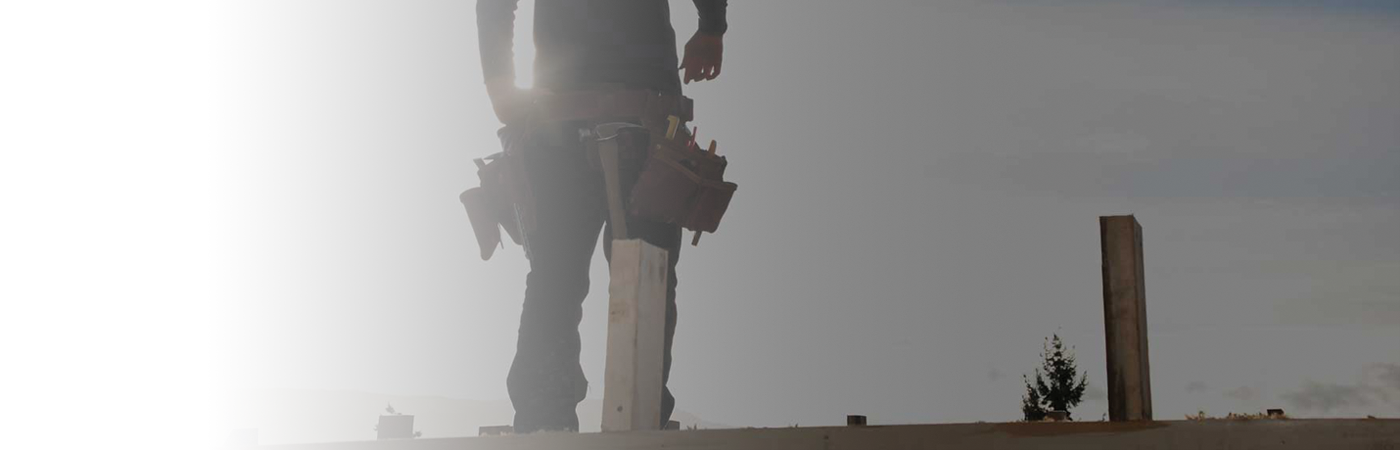 man working on a roof