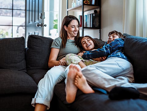 Family sitting on couch