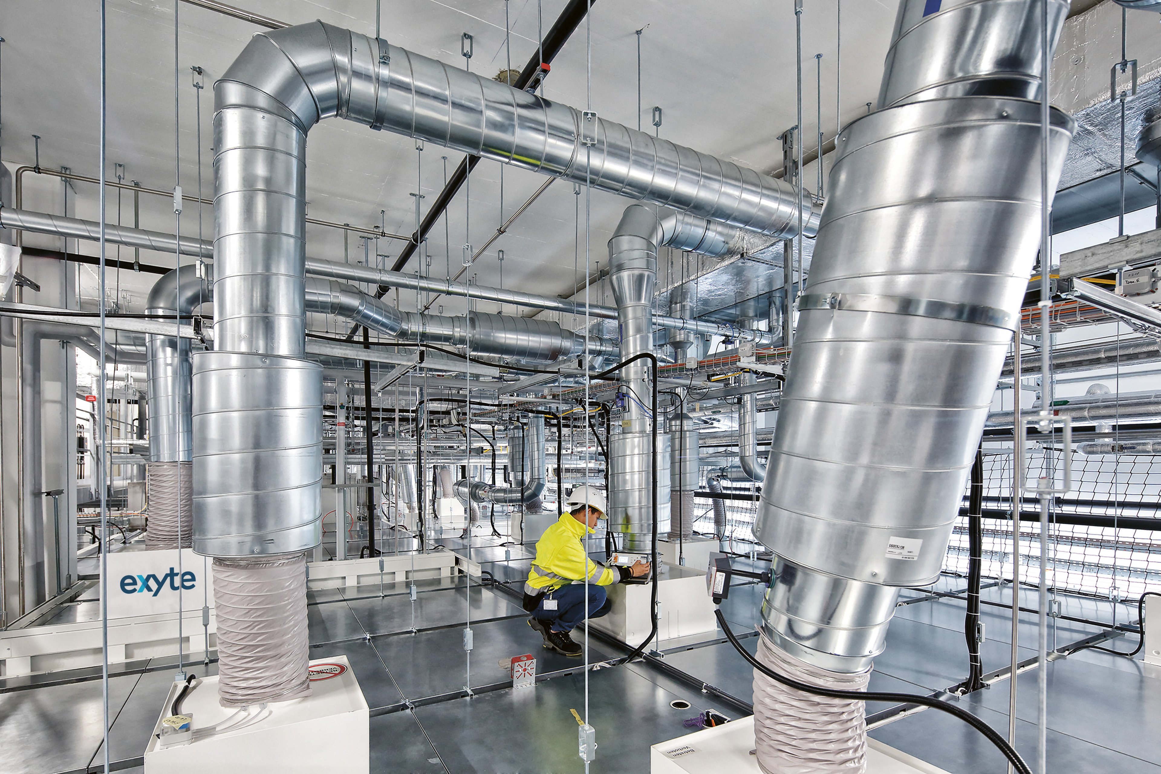 Exyte employee working on a ventilation system of a pharma facility