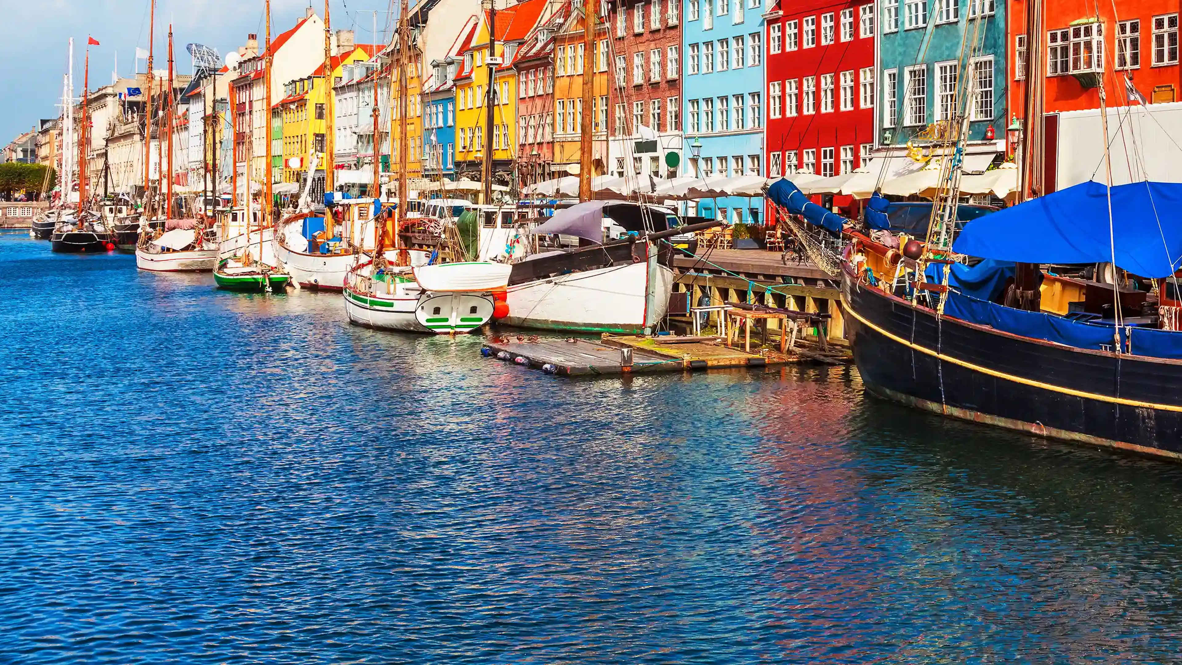 Nyhavn neighborhood in Copenhagen, Denmark's capital. the country is known for its data center industry, biopharma and life sciences sector, and renewable energy leadership. Exyte is an EPC specialist in the engineering and design of high tech facilities such as for semiconductors and biopharma and life sciences.