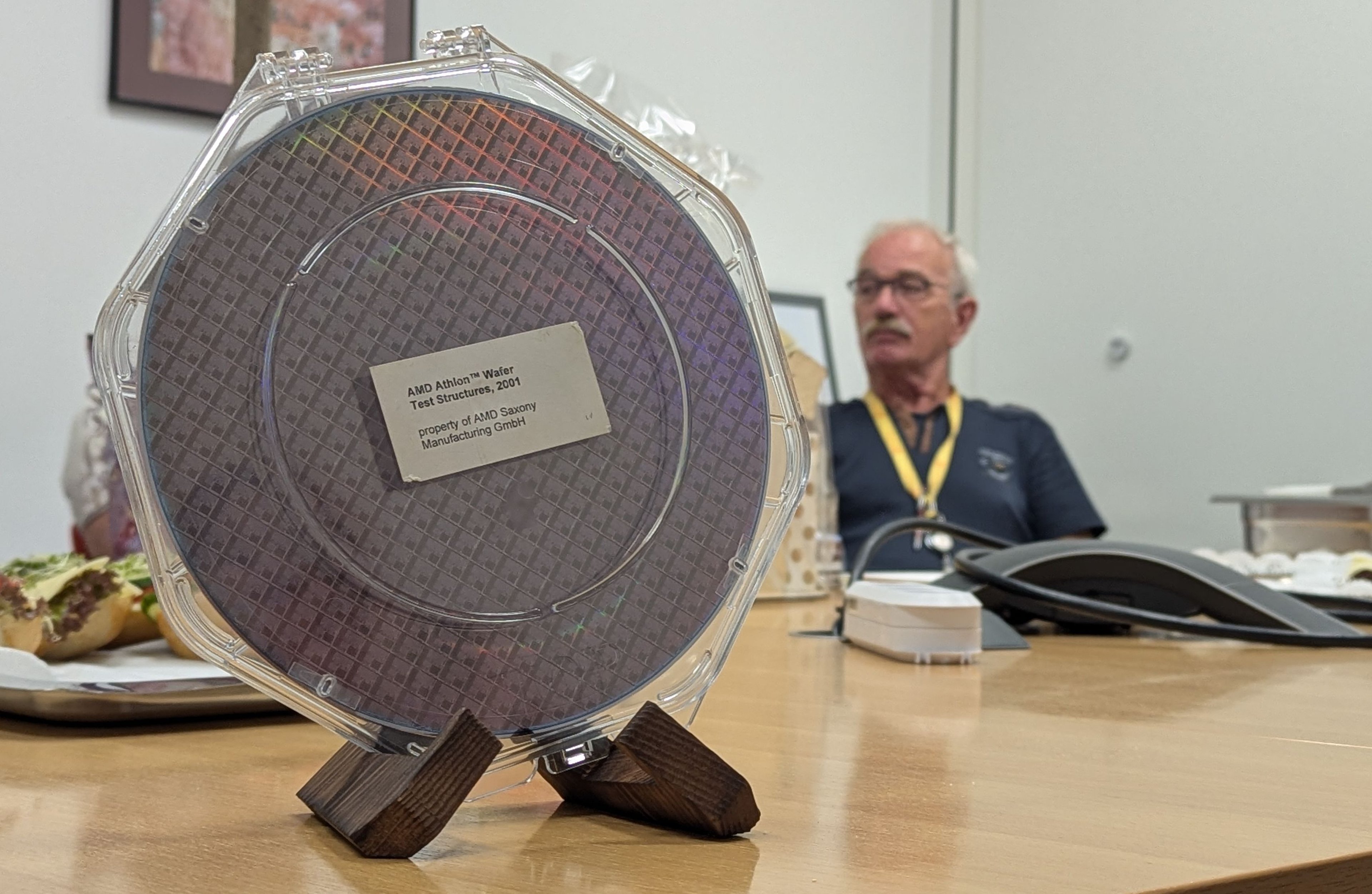 A 200 mm Athlon wafer from the early years of the fab was presented to retired Exyte employee Karlheinz Quick as a farewell gift.